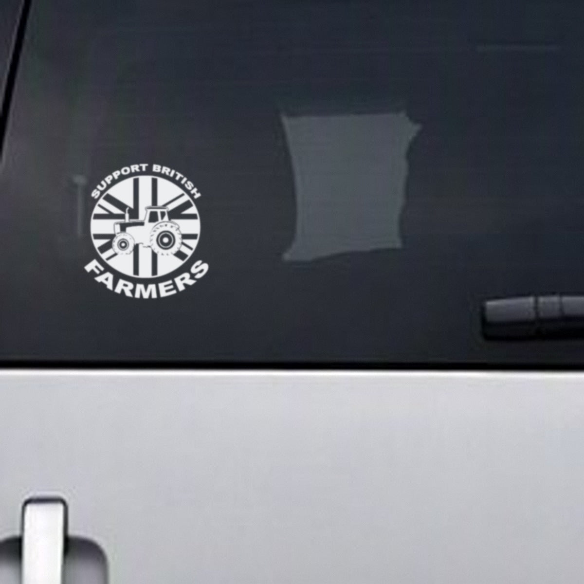 Support British Farmers white vinyl decal, about 13.5cm wide, on a vehicle rear window