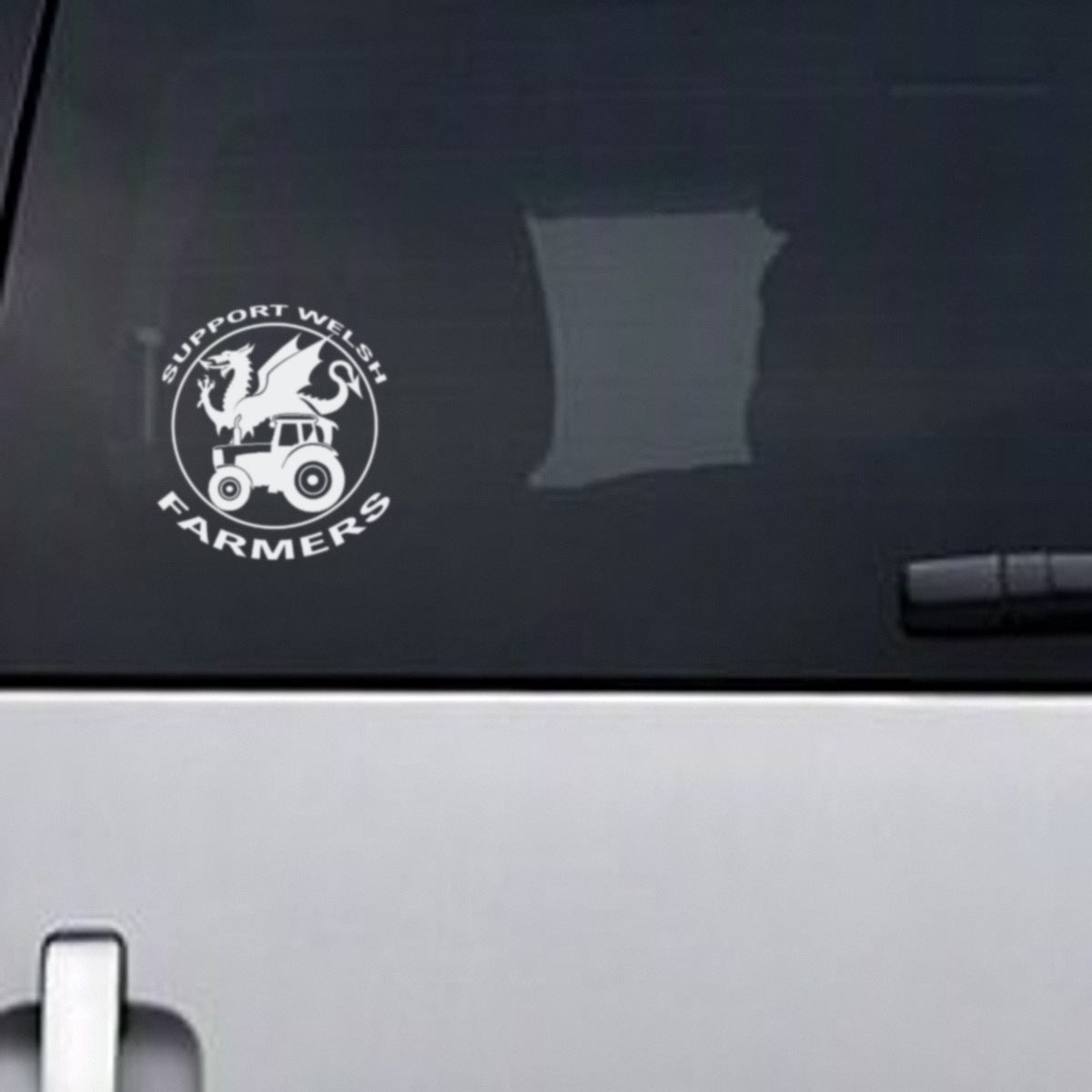 Support Welsh Farmers white vinyl decal, about 13.5cm wide, on a vehicle rear window
